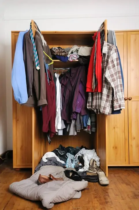 Untidy wardrobe to represent a disorganized investment portfolio