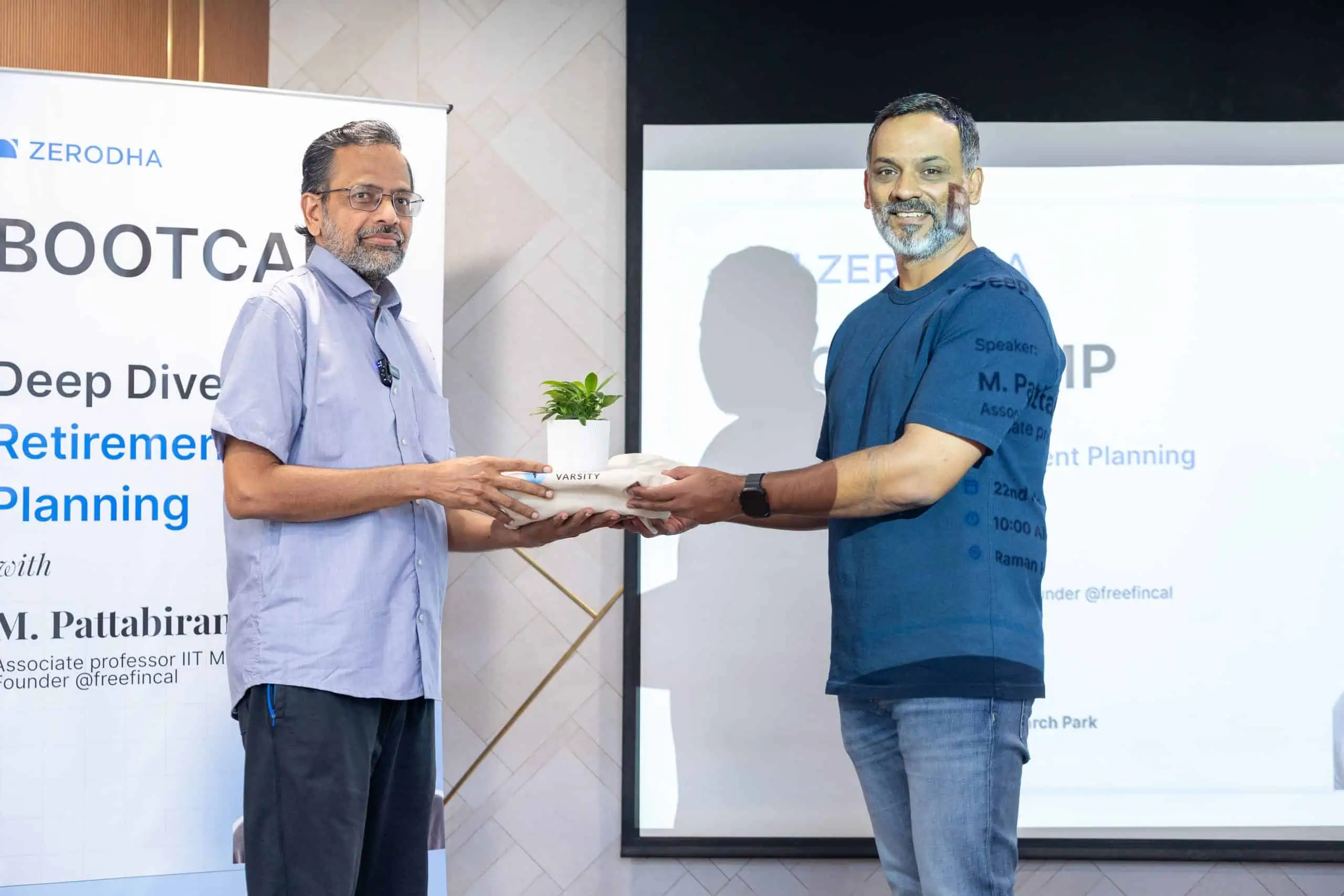 Karthik Rangappa presents a gift to M Pattabiraman at the Zerodha Retirement Planning Boot Camp Nov 22nd 2025